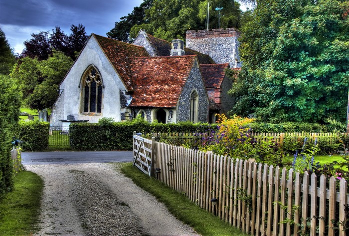 Church in the United Kingdom with a wooden fence