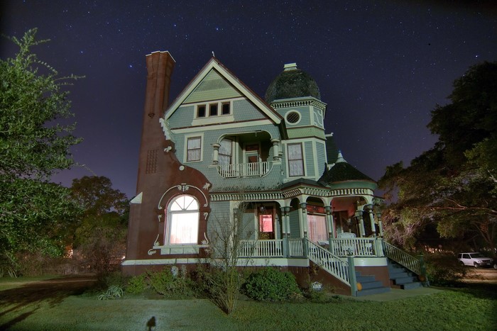 Victorian House at Night Under Stars in Texas