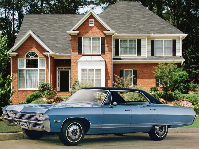 1968 Chevrolet Caprice parked in front of a brick house
