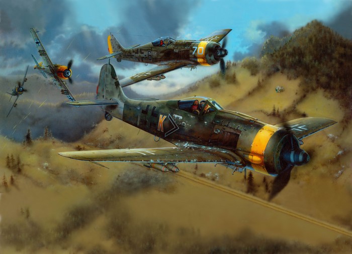 FW-190F Airplanes in Flight Over Hilly Terrain