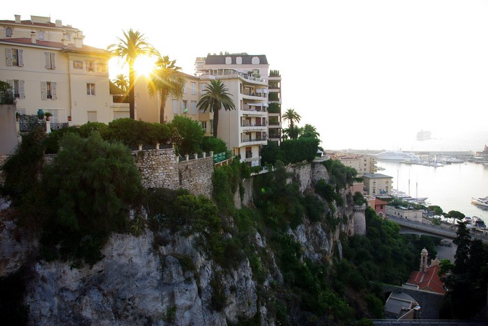 Apartment buildings on a cliff overlooking a harbor in Monaco