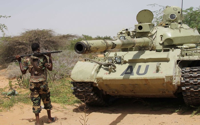Soldier with machine gun and AU tank