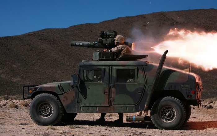 Military vehicle firing a missile