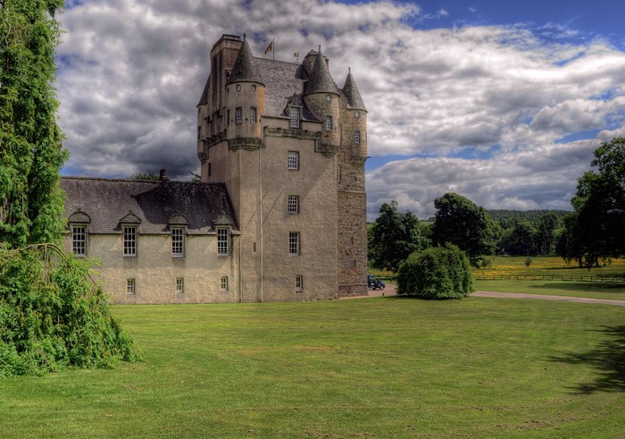 Castle Fraser Scotland with green lawn and trees