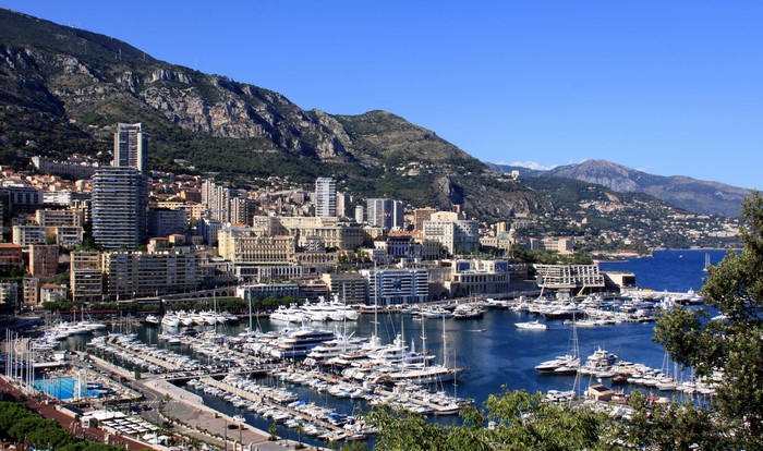 Port of Monaco with yachts and mountains