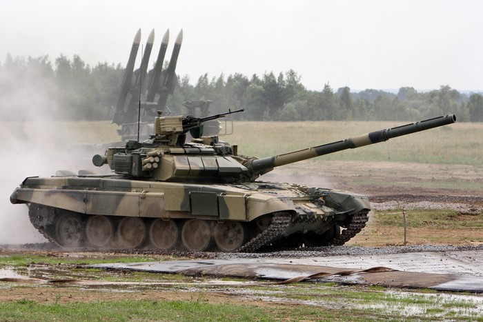 T-72 tank with missile launchers in background