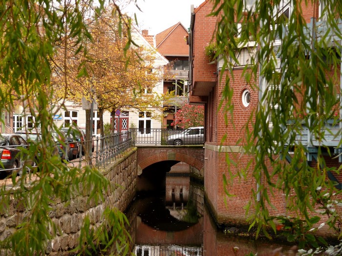 Canal in a German town with autumn trees