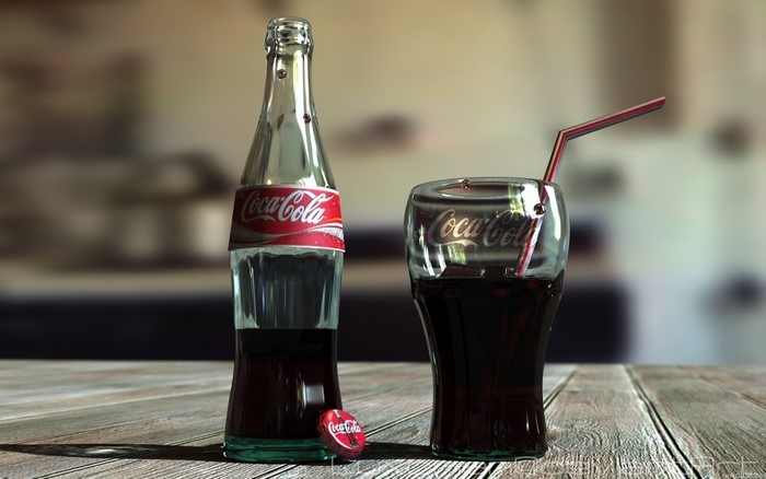Coca-Cola bottle and glass with straw