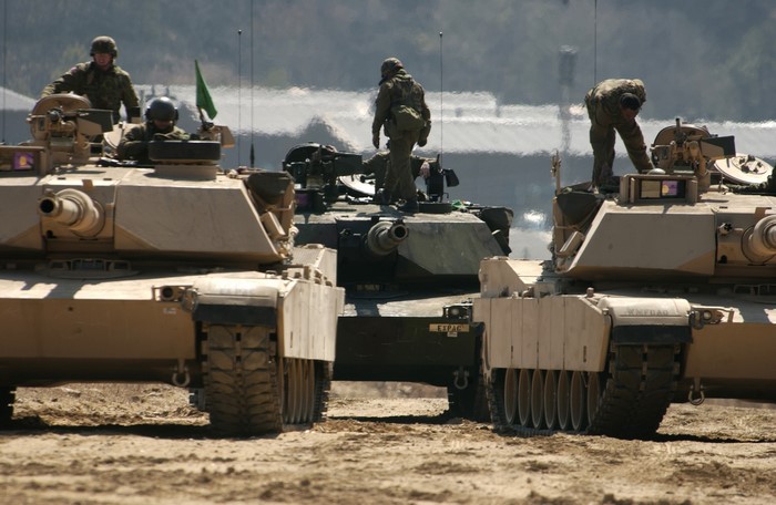 Soldiers on tanks