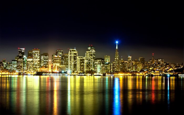 San Francisco skyline at night with bay reflections