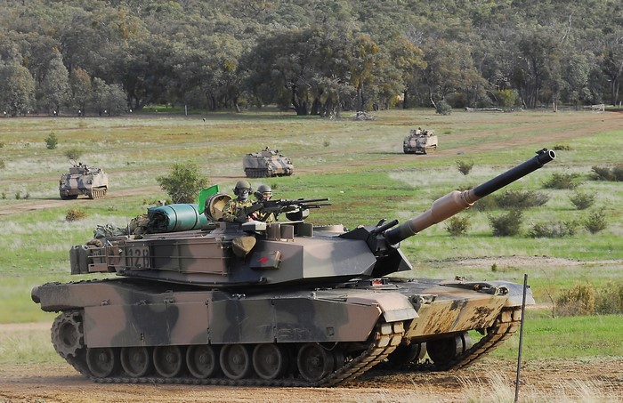 Tanks and armored vehicles in a field