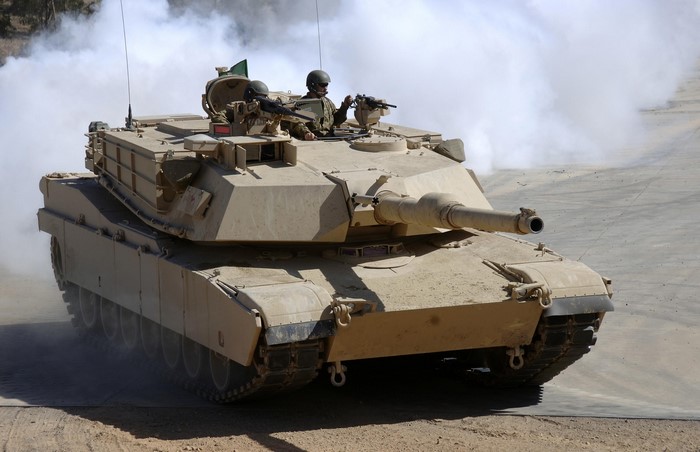 M1 Abrams tank with crew in smoke