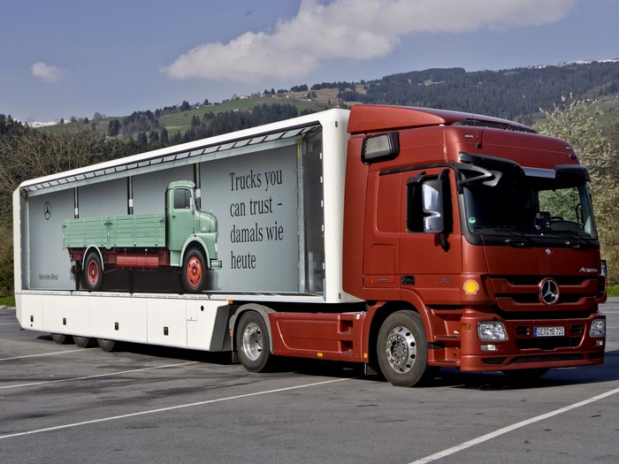 Mercedes-Benz Actros truck with trailer advertisement