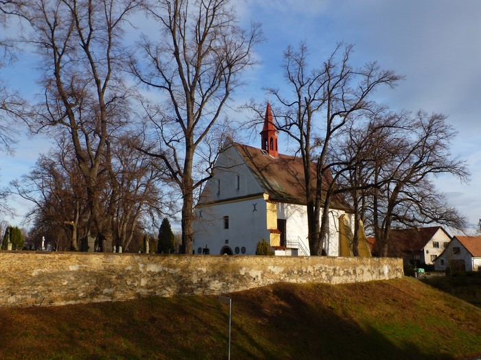 Church with a red spire and trees