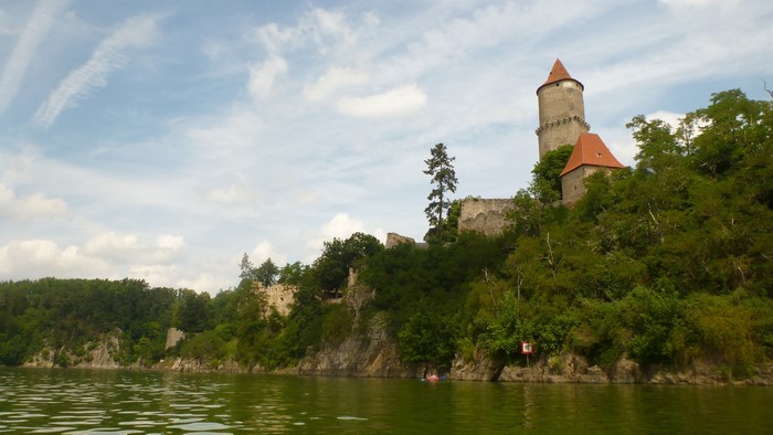 Castle ruins on a cliff overlooking a lake