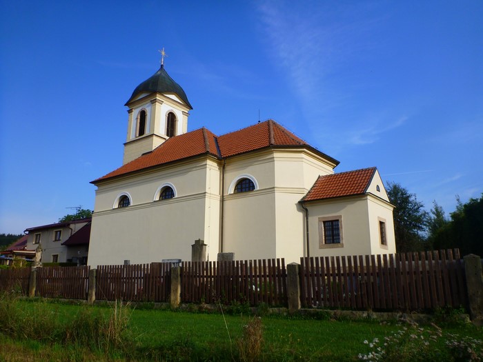 Church with a bell tower and a fence