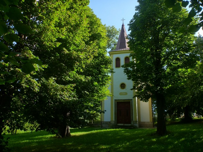 Chapel with a cross and trees