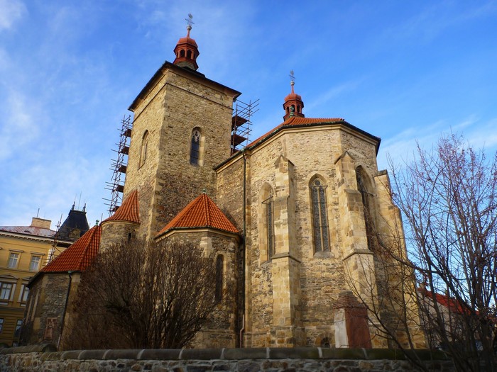 Stone Church with Red Roof and Blue Sky