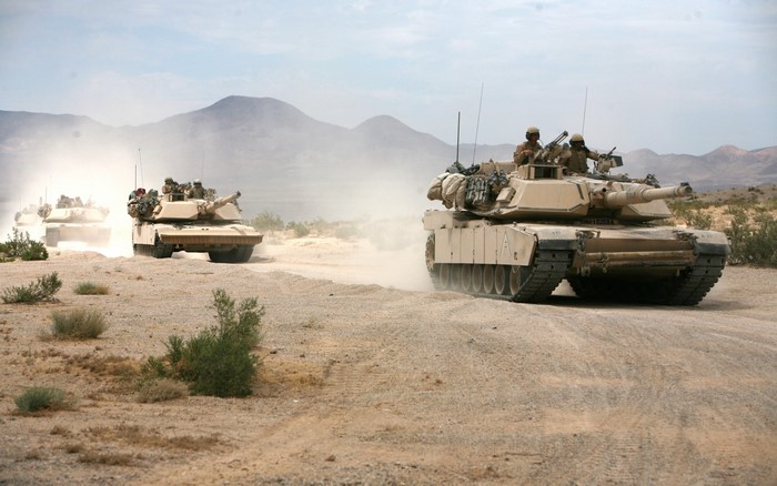 M1 Abrams Tanks in Desert Landscape