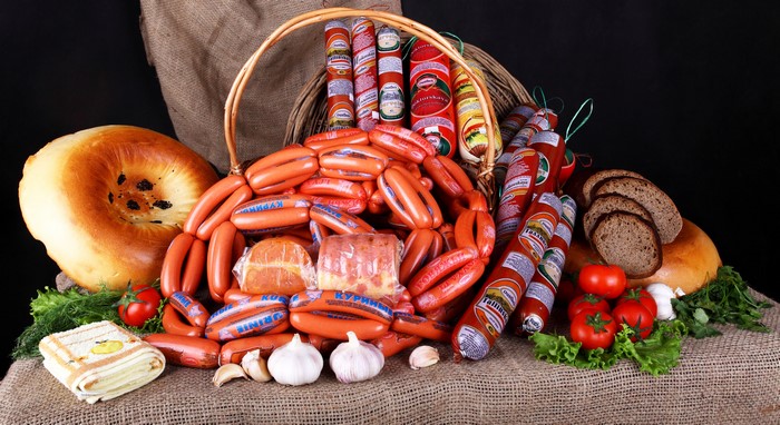 Meat products, sausages, bread, and vegetables
