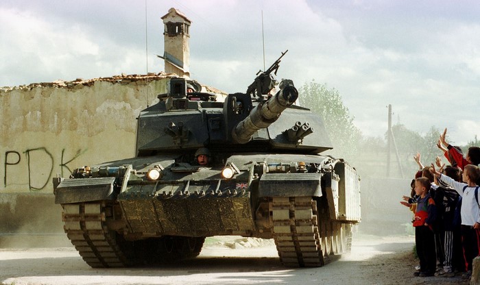 British Challenger 2 tank with children waving
