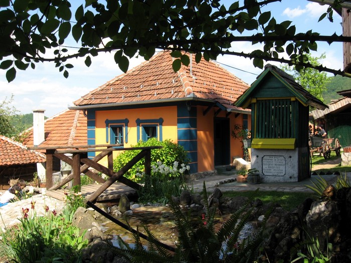 Traditional houses and well in Serbia
