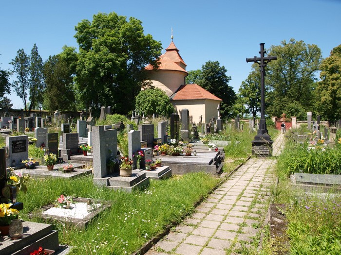 Cemetery with a small church and a large cross