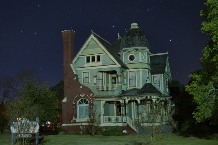 Victorian House at Night with Stars in Texas, USA