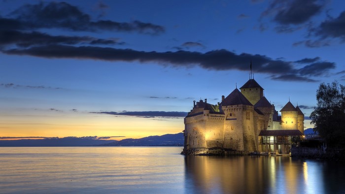 Chateau de Chillon castle on Lake Geneva at dusk