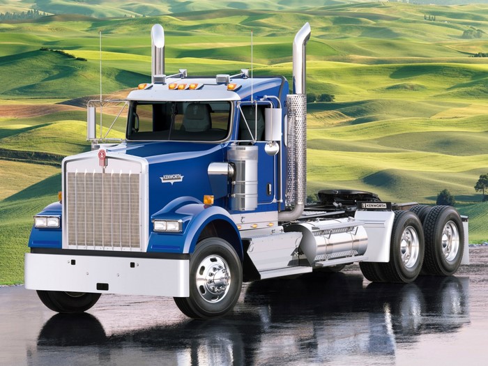 Blue Kenworth Semi-Truck on Wet Road