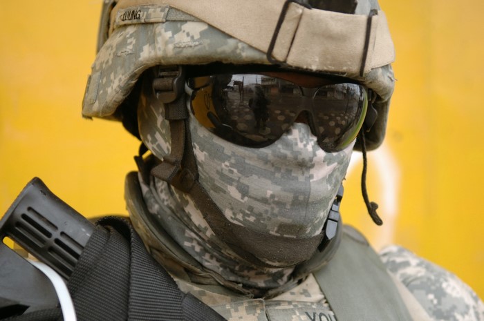 Soldier in camouflage gear and helmet