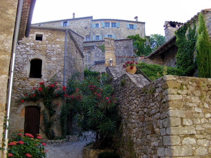 Stone houses in a French village with flowers