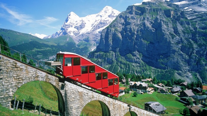 Red Funicular Railway in the Swiss Alps
