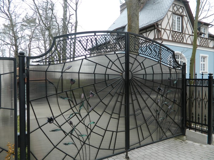Wrought iron gate with spiderweb design in Svetlogorsk, Russia