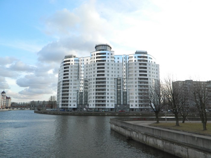 Modern apartment buildings on a river in Kaliningrad, Russia
