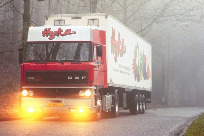 Red DAF 3600 ATi Hyka Truck in Fog
