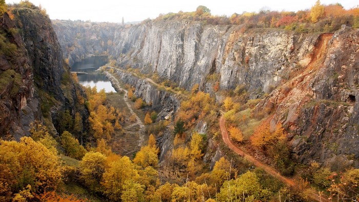 Quarry with a lake and autumn trees