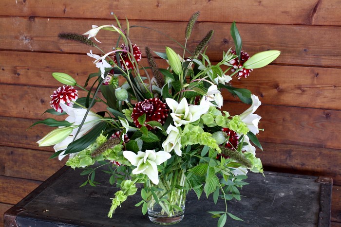 Bouquet of white lilies and dark red dahlias