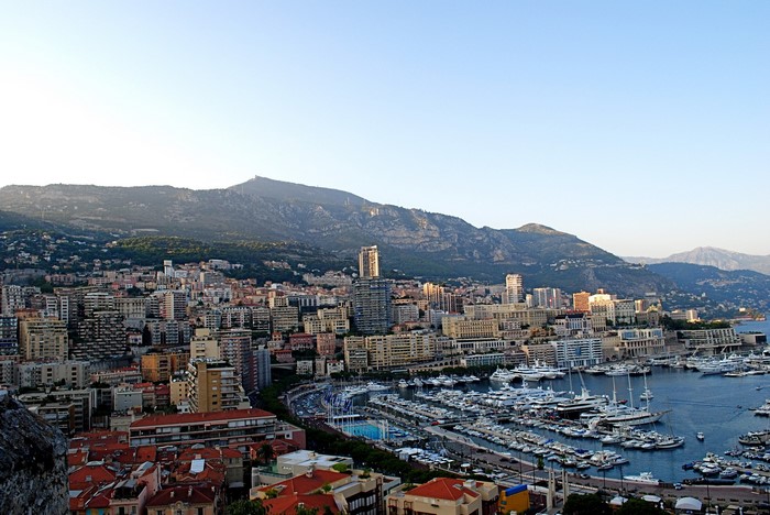 Monaco cityscape with harbor and mountains