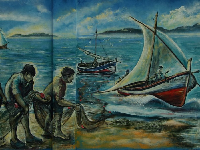 Fishermen with nets and boats on the sea
