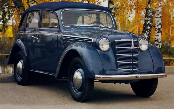 Blue Moskvich car parked outdoors in autumn