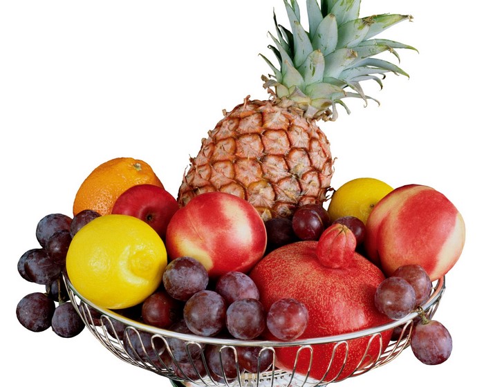 Fruit basket with pineapple, oranges, apples, lemons, grapes, plums, and pomegranate