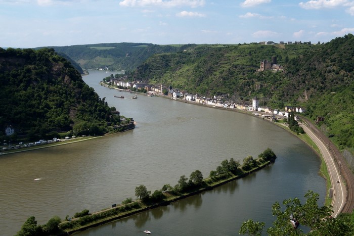 River valley with town and castle ruins