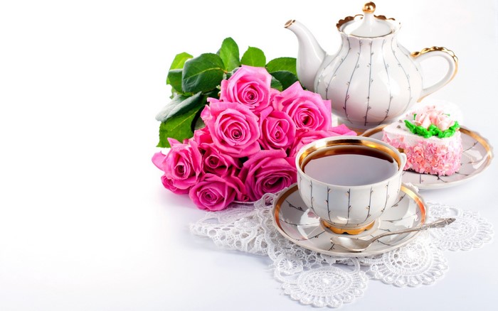 Tea set with pink roses and cake