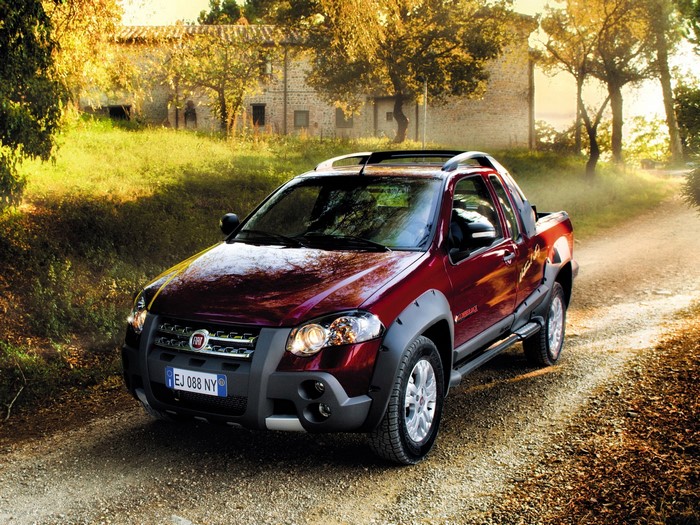 Red Fiat Strada Pickup Truck on Dirt Road