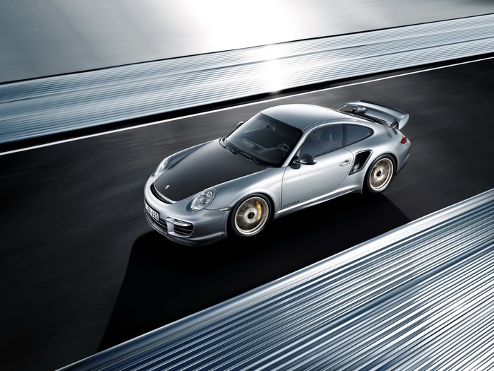 Silver Porsche 911 GT2 on a Racetrack