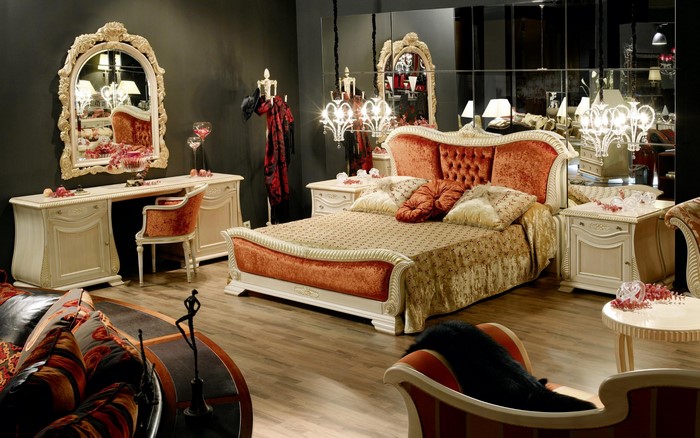 Luxurious bedroom with ornate furniture and mirrors
