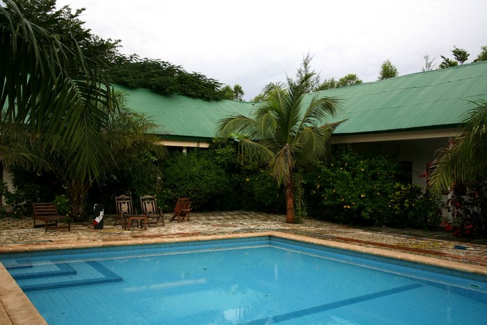 Resort with a swimming pool and palm trees