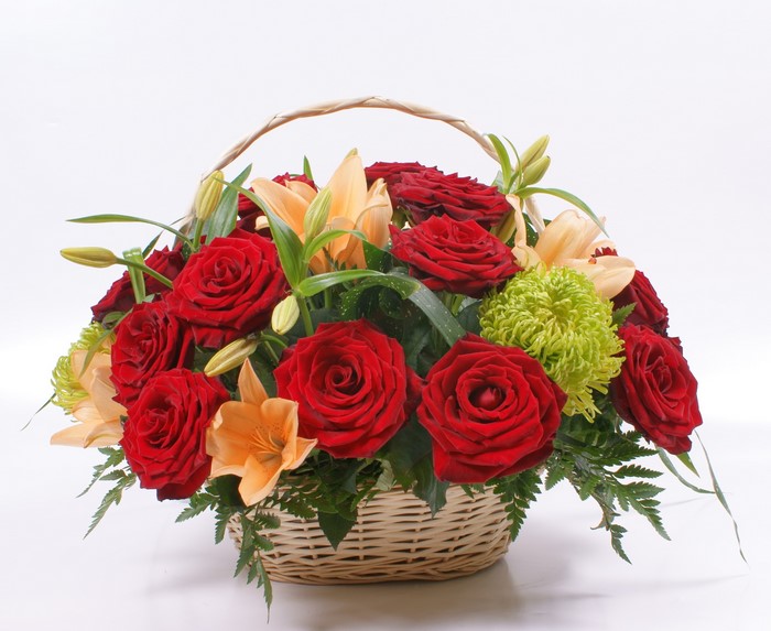 Basket of red roses and lilies