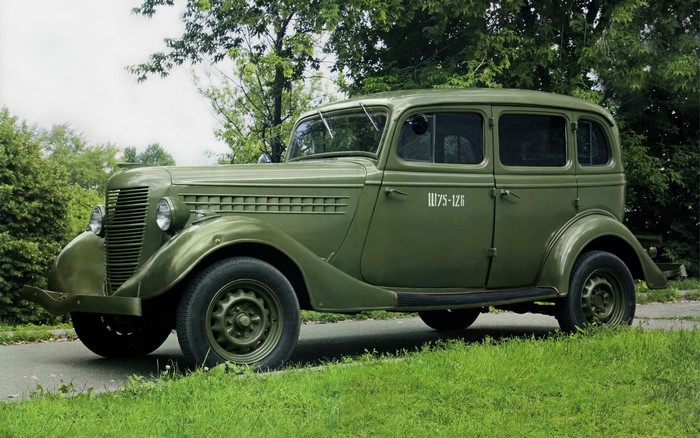 Green vintage GAZ-M1 car with inscription